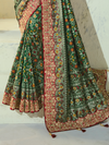 Bottle Green Patola Silk Saree With Contrast Blouse