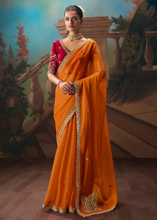 Saffron Orange Organza Silk Saree with Red Contrast Blouse