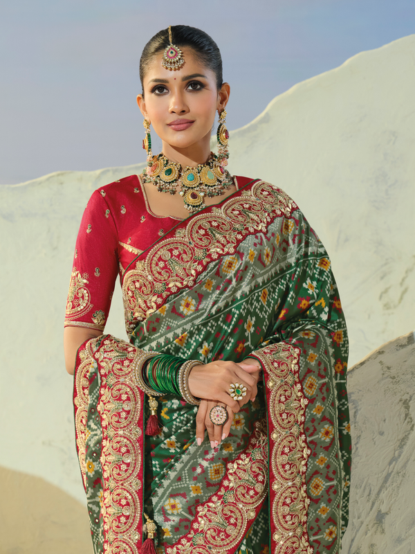 Bottle Green Patola Silk Saree With Contrast Blouse