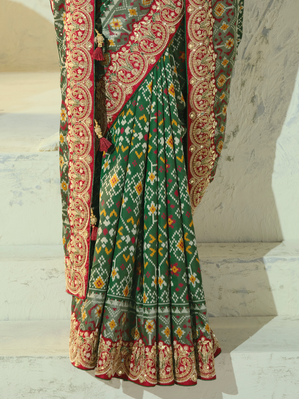 Bottle Green Patola Silk Saree With Contrast Blouse