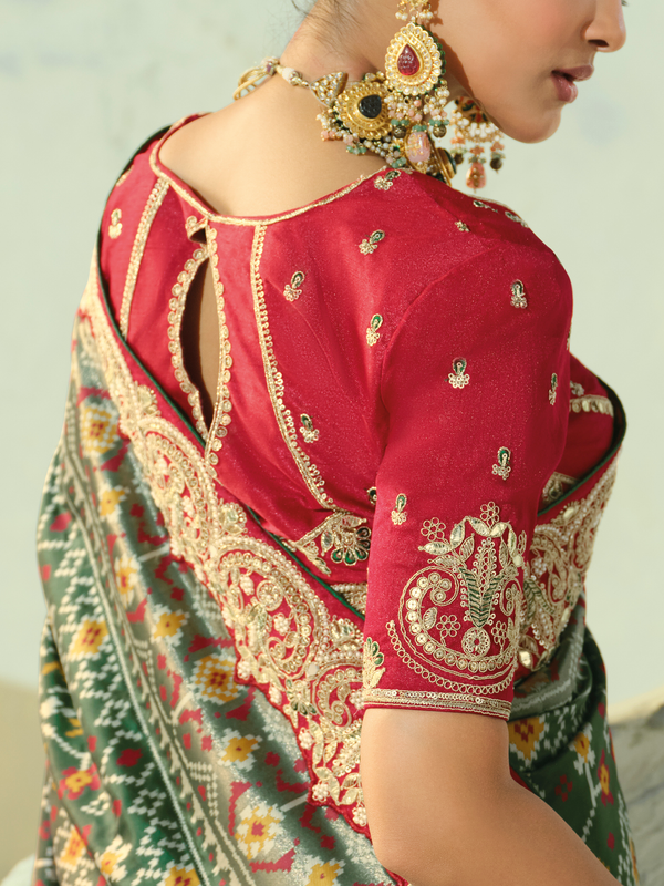 Bottle Green Patola Silk Saree With Contrast Blouse