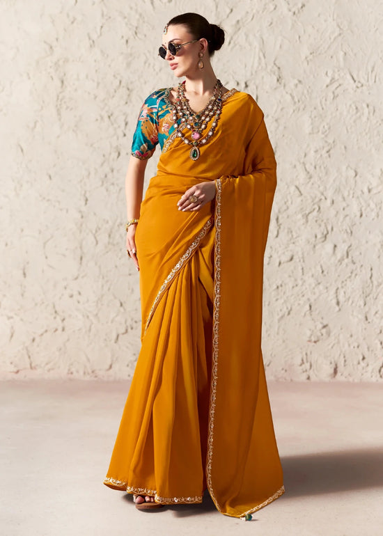 Deep Marigold Designer Organza Saree with Teal Contrast Blouse