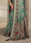 Luxurious Pastel Green Printed Brasso Organza Saree