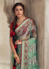 Luxurious Pastel Green Printed Brasso Organza Saree