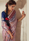 Luxurious Pastel Pink Printed Brasso Organza Saree