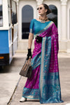 Magenta Banarasi Silk Saree With Peacock Blue Zari Border