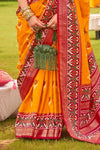 Mango Yellow And Festive Red Printed Patola Silk Saree