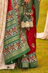 Sangria Maroon And Green Printed Patola Silk Saree