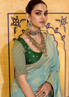 Sky Blue Banarasi Crepe Silk Saree with Dark Green Contrast Blouse