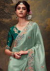 Soft Pastel Green Designer Organza Silk Saree With Contrast Blouse